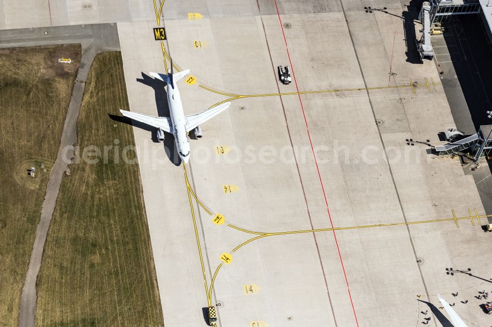 Nürnberg from the bird's eye view: Airliner- Passenger aircraft of Lufthansa rolling on the apron of the airport in Nuremberg in the state Bavaria, Germany