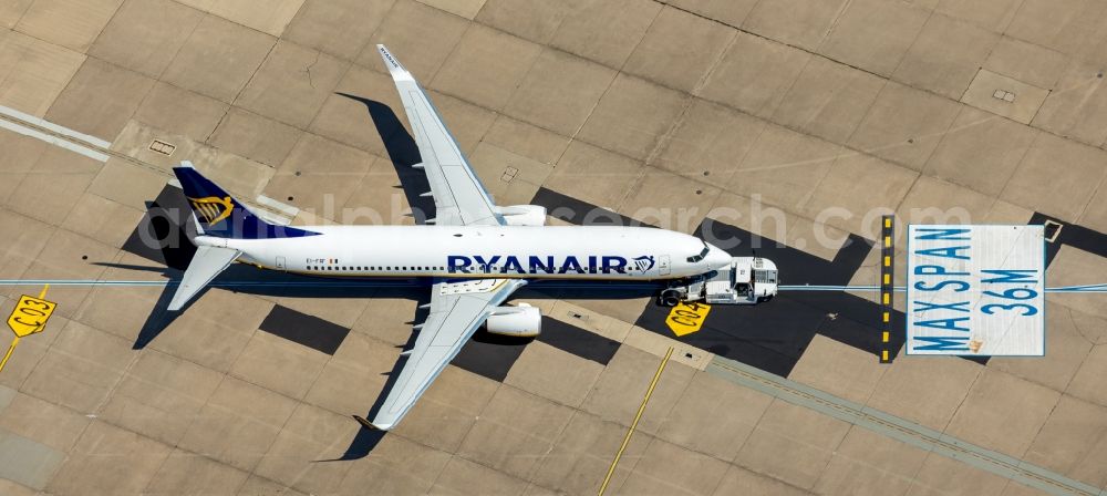 Köln from above - Passenger airplane registration EI-FRF Ryanair typ Boeing 737-8AS(WL) in parking position - parking area at the airport in the district Grengel in Cologne in the state North Rhine-Westphalia, Germany