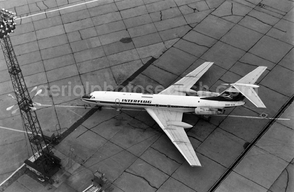 Aerial image Schönefeld - Passenger aircraft Tupolev Tu-134A of INTERFLUG with the registration DDR-SCK on the parking position - parking area at the airport in Schoenefeld in the state Brandenburg, Germany