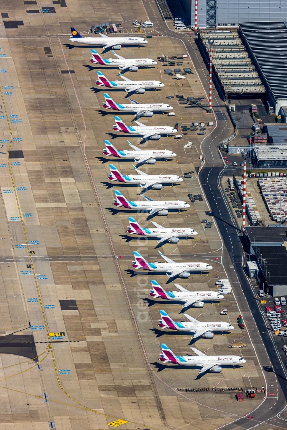 Düsseldorf from the bird's eye view: Passenger airplanes crisis related in parking position - parking area at the airport in the district Lohausen in Duesseldorf in the state North Rhine-Westphalia, Germany