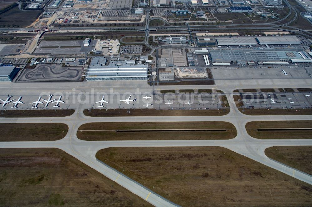 München-Flughafen from the bird's eye view: Passenger aircraft decommissioned due to the crisis on the parking positions and parking space at the airport in Munich in the state Bavaria, Germany