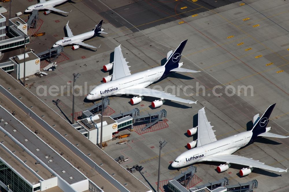 München-Flughafen from the bird's eye view: Passenger aircraft decommissioned due to the crisis on the parking positions and parking space at the airport in Munich in the state Bavaria, Germany