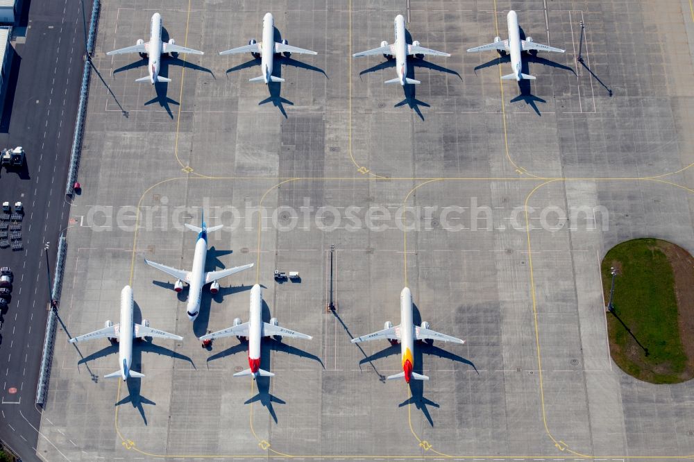 Erfurt from above - Brand-new passenger aircrafts of the type Airbus A321neo and A320neo covered in snow in winter before delivery to the parking position caused by the pandemic - parking area and alternative parking space at the Erfurt Weimar airport in the Bindersleben district of Erfurt in the state Thuringia, Germany