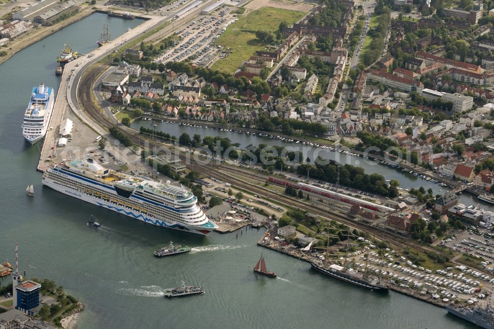 Aerial image Rostock / Warnemünde - Passenger ship AIDAblu, a cruise ship of AIDA Cruises in the port of Warnemünde, Rostock in Mecklenburg-Vorpommern. The ship was built in 2008 by Meyer Werft