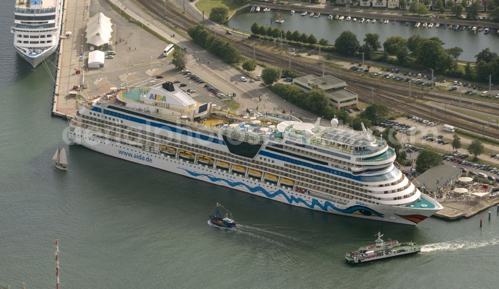 Aerial image Rostock / Warnemünde - Passenger ship AIDAblu, a cruise ship of AIDA Cruises in the port of Warnemünde, Rostock in Mecklenburg-Vorpommern. The ship was built in 2008 by Meyer Werft