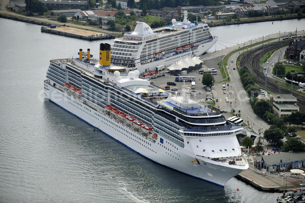 Aerial photograph Rostock - Warnemünde - Blick auf den Kreuzfahrt - Hafen in Warnemünde mit dem Passagierschiff COSTA ATLANTICA . Die Costa Atlantica ist ein Kreuzfahrtschiff der Reederei Costa Crociere. Das Einsatzgebiet des 290m langen Luxusliners ist im Sommer das Nordland und die Ostsee. View of the Cruise - Port of Rostock - Warnemünde with the passenger ship COSTA ATLANTICA. The Costa Atlantica is a cruise ship for Costa Crociere.