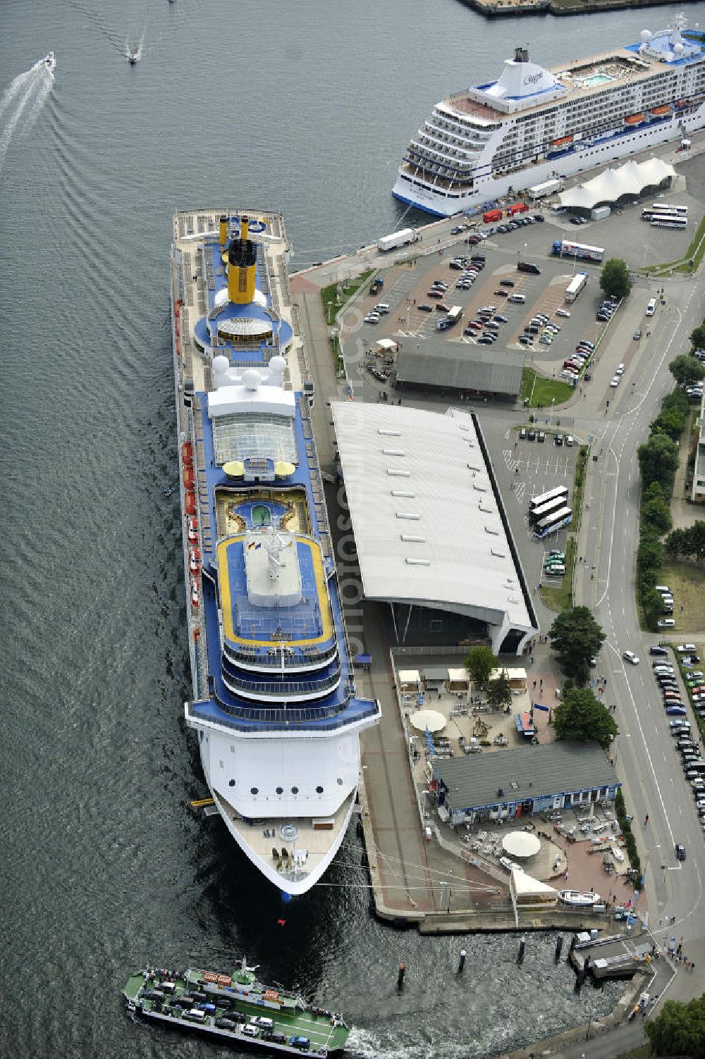 Aerial image Rostock - Warnemünde - Blick auf den Kreuzfahrt - Hafen in Warnemünde mit dem Passagierschiff COSTA ATLANTICA . Die Costa Atlantica ist ein Kreuzfahrtschiff der Reederei Costa Crociere. Das Einsatzgebiet des 290m langen Luxusliners ist im Sommer das Nordland und die Ostsee. View of the Cruise - Port of Rostock - Warnemünde with the passenger ship COSTA ATLANTICA. The Costa Atlantica is a cruise ship for Costa Crociere.