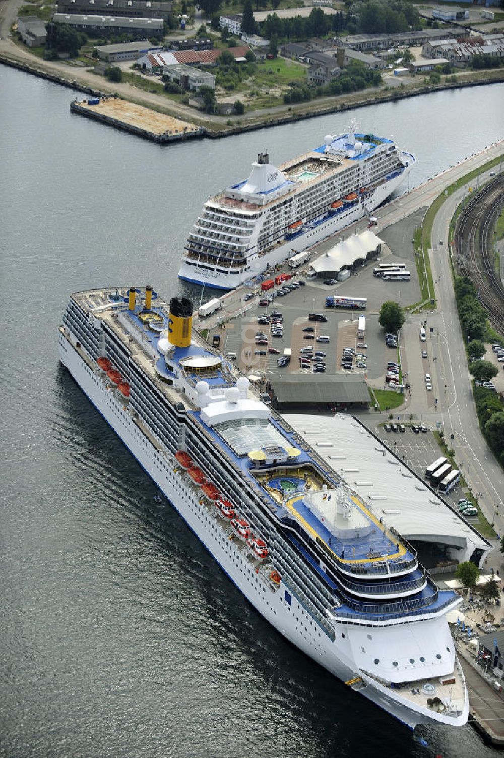 Rostock - Warnemünde from above - Blick auf den Kreuzfahrt - Hafen in Warnemünde mit dem Passagierschiff COSTA ATLANTICA . Die Costa Atlantica ist ein Kreuzfahrtschiff der Reederei Costa Crociere. Das Einsatzgebiet des 290m langen Luxusliners ist im Sommer das Nordland und die Ostsee. View of the Cruise - Port of Rostock - Warnemünde with the passenger ship COSTA ATLANTICA. The Costa Atlantica is a cruise ship for Costa Crociere.