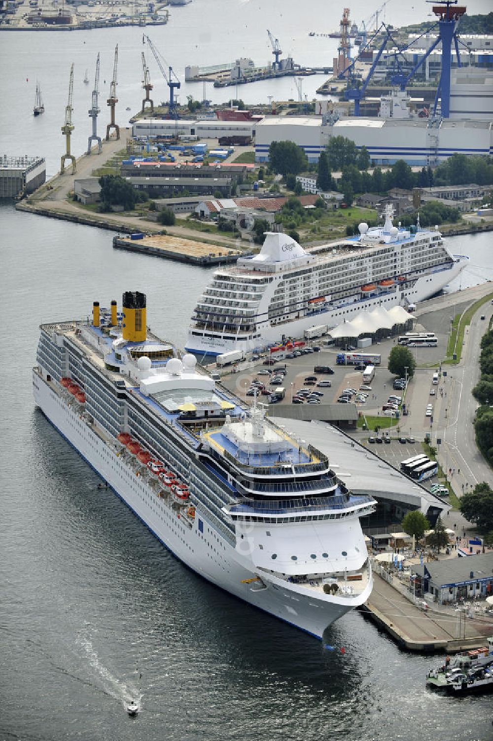 Rostock - Warnemünde from the bird's eye view: Blick auf den Kreuzfahrt - Hafen in Warnemünde mit dem Passagierschiff COSTA ATLANTICA . Die Costa Atlantica ist ein Kreuzfahrtschiff der Reederei Costa Crociere. Das Einsatzgebiet des 290m langen Luxusliners ist im Sommer das Nordland und die Ostsee. View of the Cruise - Port of Rostock - Warnemünde with the passenger ship COSTA ATLANTICA. The Costa Atlantica is a cruise ship for Costa Crociere.