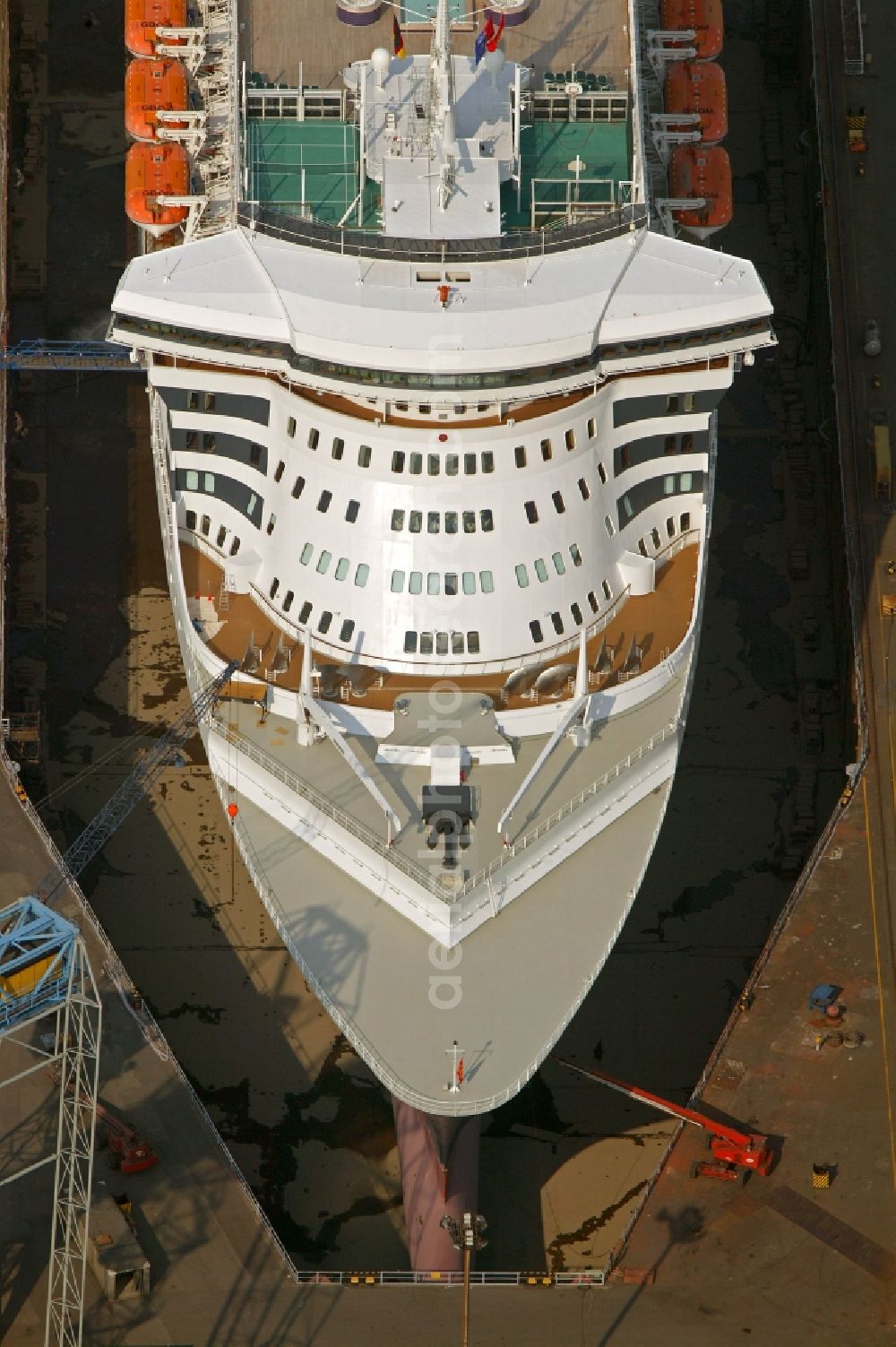 Hamburg from the bird's eye view: Passenger ship and luxury liner Queen Mary 2 on the Elbe 17 dry dock of Blohm and Voss in Hamburg company for maintenance and repairs. It is at 345 meters, the largest passenger ship in the world. The German shipyard Blohm and Voss is a subsidiary of ThyssenKrupp AG