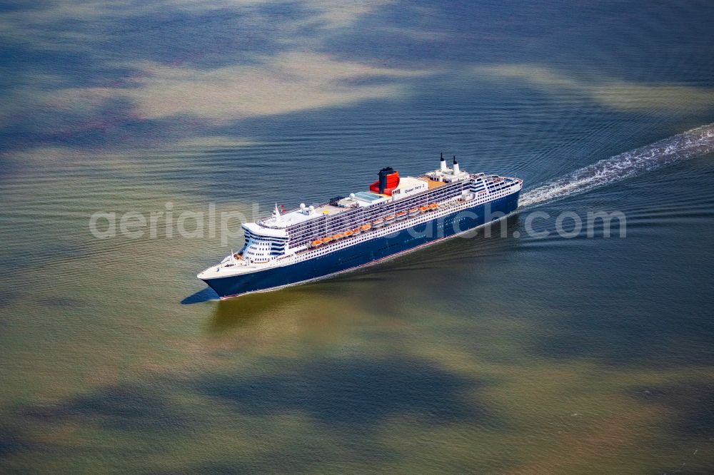 Balje from above - Passenger ship and luxury liner ship Queen Mary 2 at full speed on the Elbe near Balje in the district of Stade