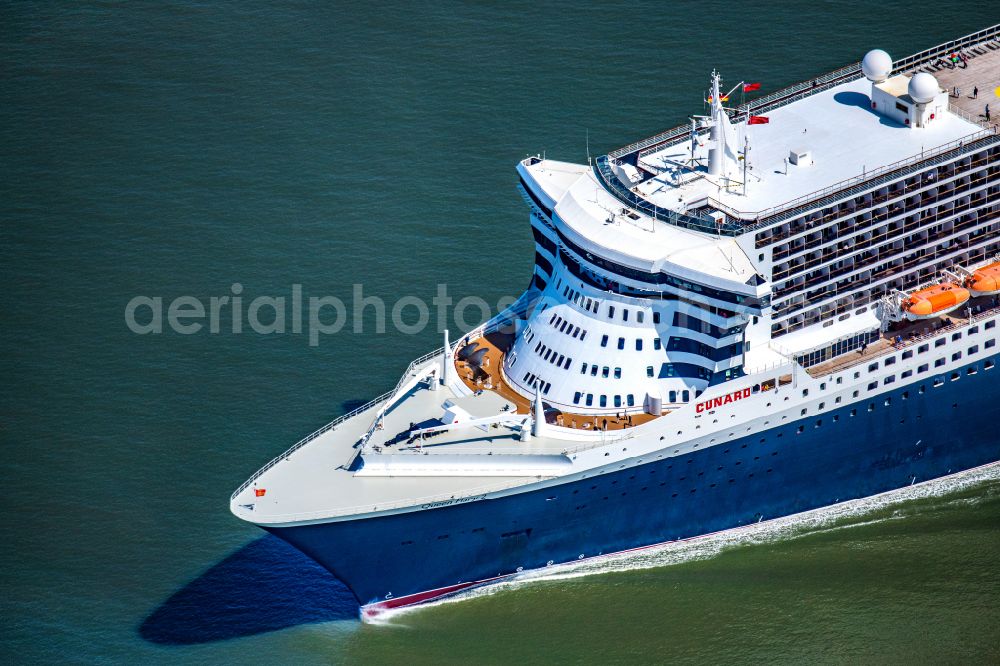 Balje from above - Passenger ship and luxury liner ship Queen Mary 2 at full speed on the Elbe near Balje in the district of Stade