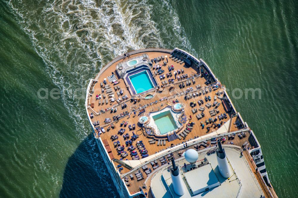 Aerial image Balje - Passenger ship and luxury liner ship Queen Mary 2 at full speed on the Elbe near Balje in the district of Stade