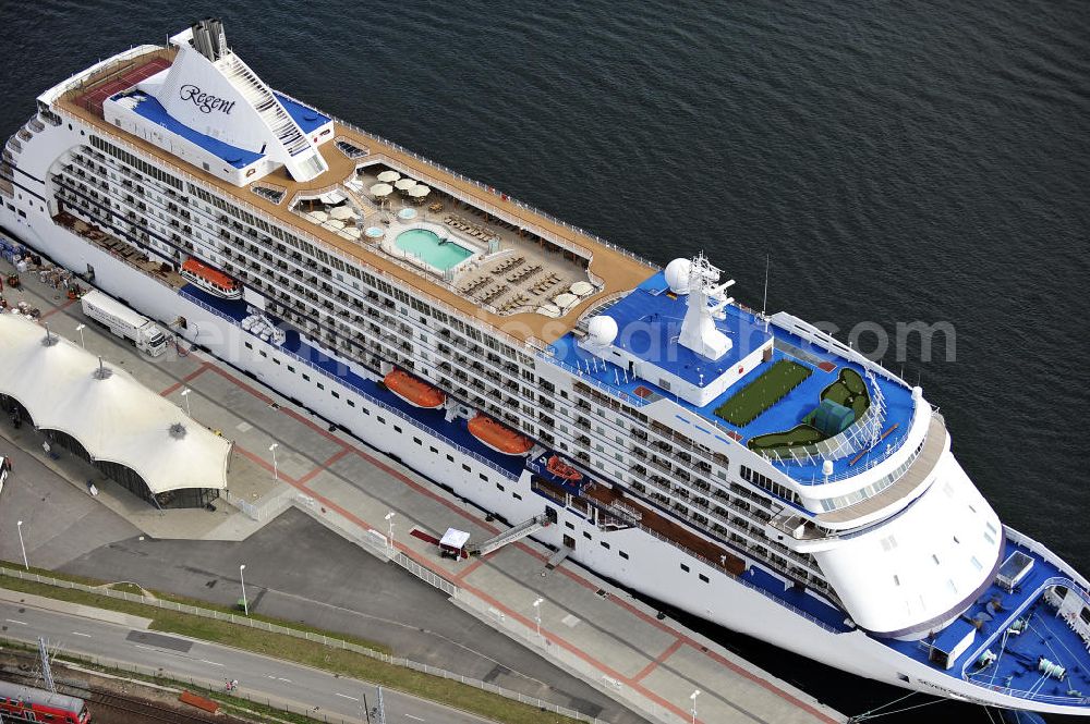 Aerial image Rostock - Warnemünde - Blick auf den Kreuzfahrt - Hafen in Warnemünde mit dem Passagierschiff Seven Seas Voyager . Die Seven Seas Voyager ist ein Kreuzfahrtschiff der Reederei Regent. View of the Cruise - Port of Rostock - Warnemünde with the passenger ship Seven Seas Voyager. The Costa Atlantica is a cruise ship for Regent.