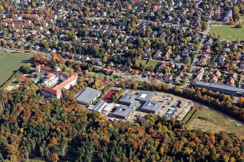 Pullach im Isartal from the bird's eye view: Pater-Rupert-Mayer School center of the Archdiocese of Munich-Freising with construction site of the new building of the primary school, kindergarten and day-care center and grammar school in Pullach near Munich in the state of Bavaria