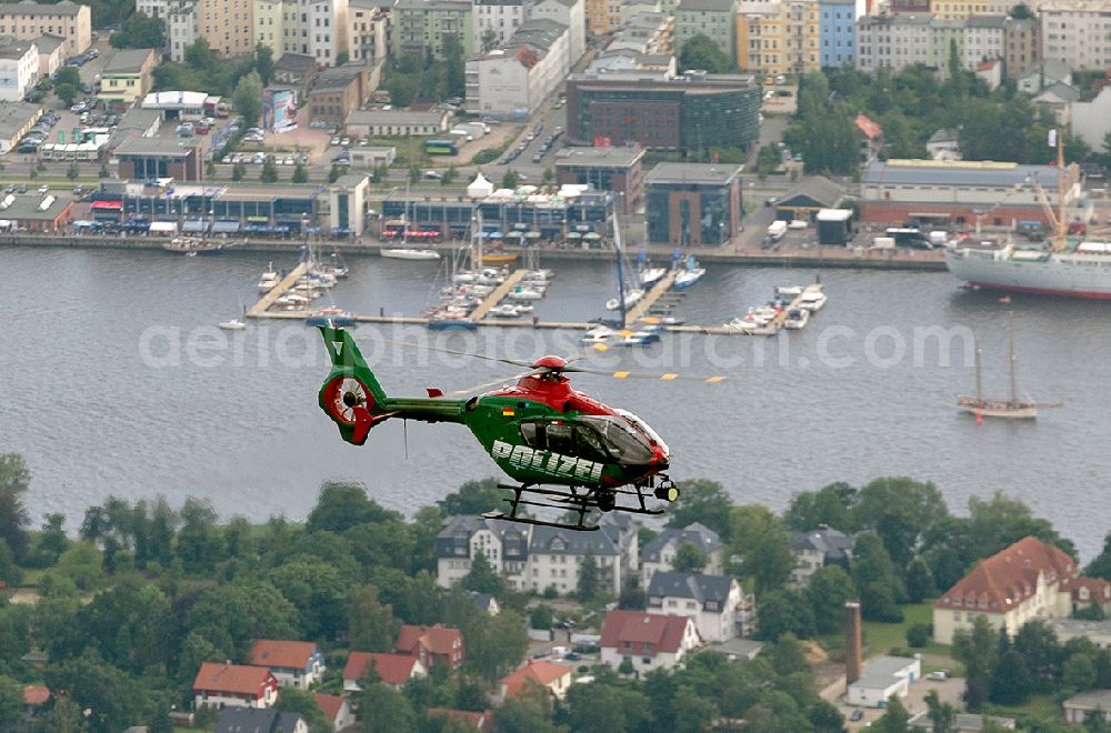 Aerial photograph Rostock - Patrol flight of the police helicopter Merlin 2 overhad Rostock in Mecklenburg-Western Pomerania