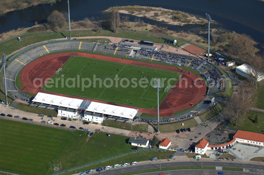 Dessau - Roßlau from above - Blick auf das Paul-Greifzu-Stadion. Es ist ein Mehrzweckstadion welches 1952 eröffnet und 1997,2002 und 2004 saniert wurde. Die Kapazität besteht aus 18.000 Stehplätzen und 2.000 Sitzplätzen. Es beherbergt die Vereine SV Dessau 05, LAC Dessau und FC Anhalt Dessau e.V. Das Stadion gehört der Stadt Dessau-Roßlau. Kontakt: Ludwigshafener Strasse 69, 06842 Dessau, Tel. +49(0)340 882 2020