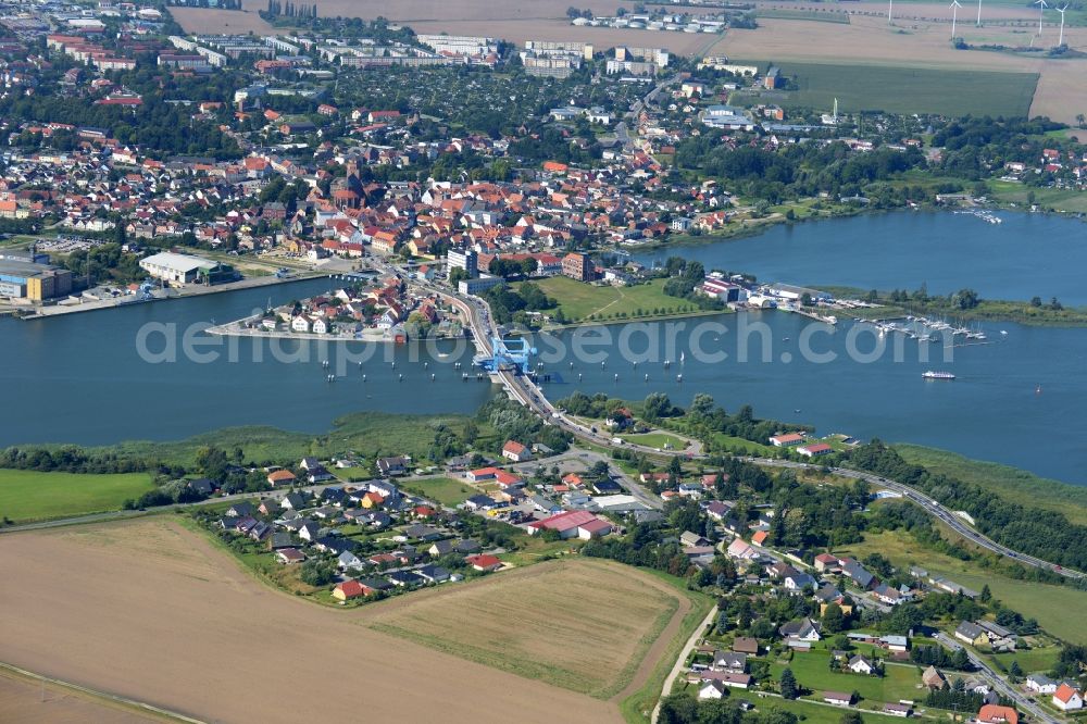 Wolgast from above - View of the Peene Bridge in Wolgast in the state Mecklenburg-Vorpommern. The Peene Bridge is a bascule bridge and crosses the Peenestream. The bridge bears the name Bridge of friendship