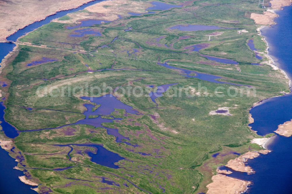 Aerial photograph Kröslin - Blick auf die Salzwiesen zwischen dem Peenestrom und der Alten Peene auf der Ostseeinsel Usedom. Das Gebiet gehört zu dem Naturschutzgebiet Peenemünder Haken, Struck und Ruden. View at a salt marsh between the Peenestrom and the old Peene on the island Usedom. The area belongs to the natural reserve Peenemunder Haken, Struck and Ruden.