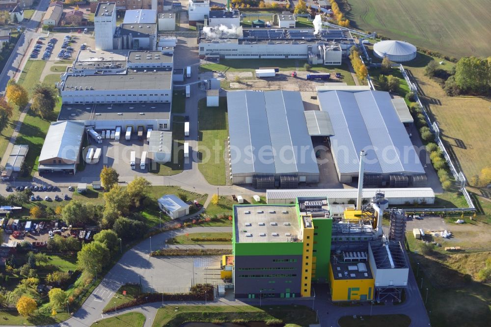 Stavenhagen from above - View at the Pfanni factory premises and the company own power plant in Stavenhagen in the federal state Mecklenburg-Vorpommern. The Pfanni GmbH & Co. OHG is a German food company headquartered in Stavenhagen, which is specialized in the manufacture of kitchen-ready potato products. The power plant was built for the power and heating supply of the Pfanni company and is operated with alternative fuels. Operator is the Nehlsen Heizkraftwerke GmbH & Co.KG