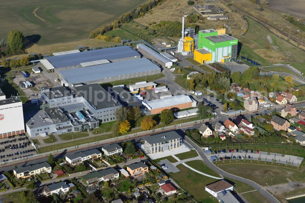 Stavenhagen from the bird's eye view: View at the Pfanni factory premises and the company own power plant in Stavenhagen in the federal state Mecklenburg-Vorpommern. The Pfanni GmbH & Co. OHG is a German food company headquartered in Stavenhagen, which is specialized in the manufacture of kitchen-ready potato products. The power plant was built for the power and heating supply of the Pfanni company and is operated with alternative fuels. Operator is the Nehlsen Heizkraftwerke GmbH & Co.KG