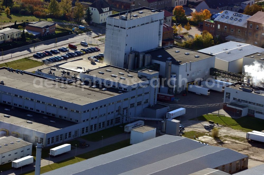 Aerial photograph Stavenhagen - View at the Pfanni factory premises and the company own power plant in Stavenhagen in the federal state Mecklenburg-Vorpommern. The Pfanni GmbH & Co. OHG is a German food company headquartered in Stavenhagen, which is specialized in the manufacture of kitchen-ready potato products. The power plant was built for the power and heating supply of the Pfanni company and is operated with alternative fuels. Operator is the Nehlsen Heizkraftwerke GmbH & Co.KG