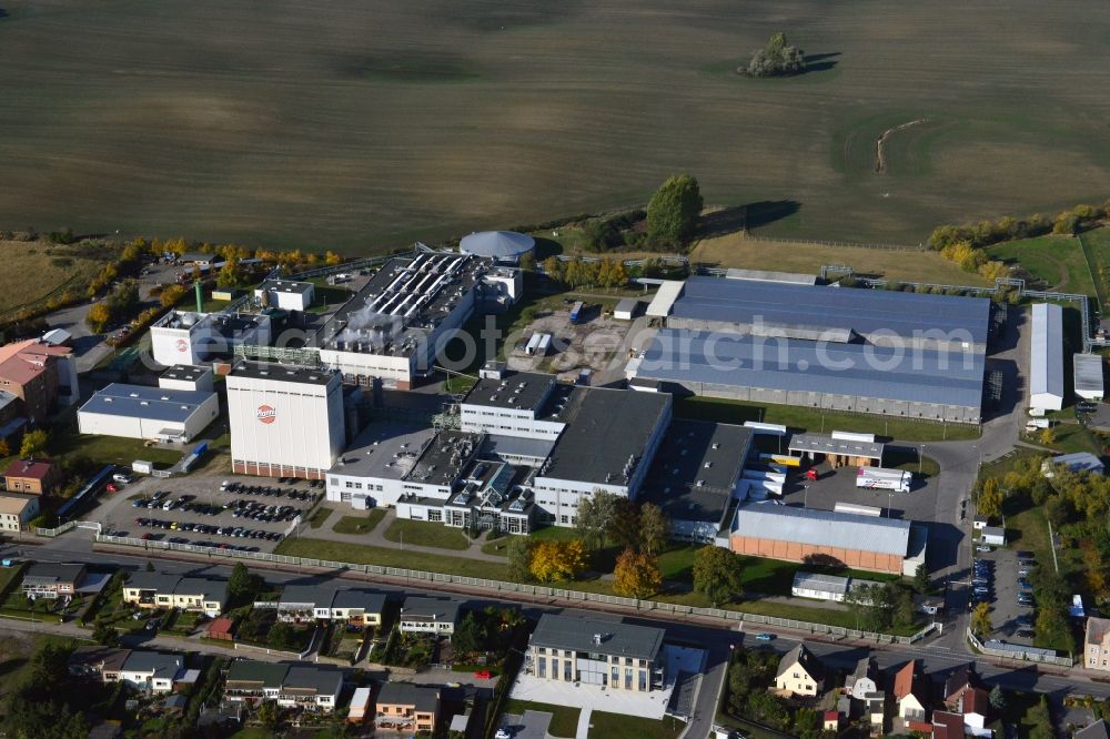 Aerial image Stavenhagen - View at the Pfanni factory premises and the company own power plant in Stavenhagen in the federal state Mecklenburg-Vorpommern. The Pfanni GmbH & Co. OHG is a German food company headquartered in Stavenhagen, which is specialized in the manufacture of kitchen-ready potato products. The power plant was built for the power and heating supply of the Pfanni company and is operated with alternative fuels. Operator is the Nehlsen Heizkraftwerke GmbH & Co.KG