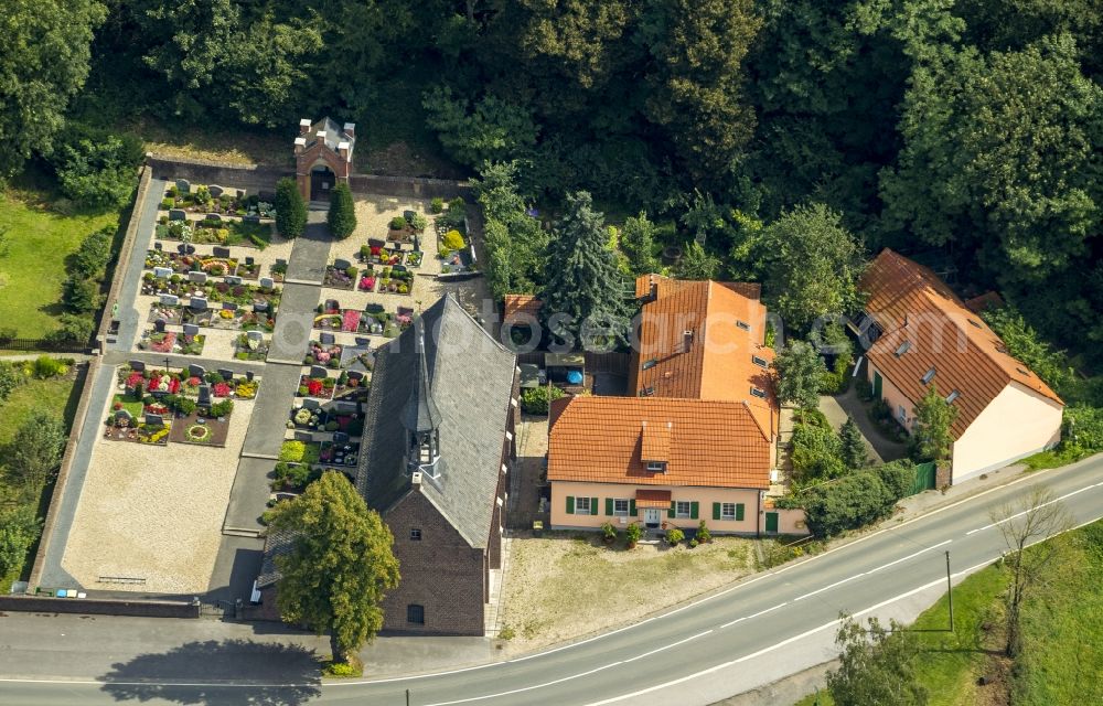 Aerial image Kamp-Lintfort - The parish church Saint Mariae Himmelfahrt with the cemetery in the district Eyll on the Eyller Strasse in Kamp-Lintfort in the state North Rhine-Westphalia