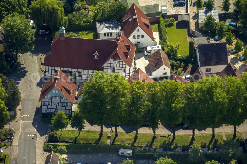 Aerial photograph Rietberg - Parish church in the Muentestrasse in Rietberg in the state North Rhine-Westphalia. The building of this church is a half-timbered building