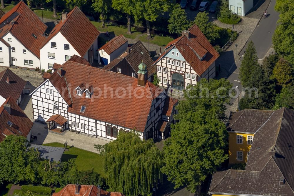 Rietberg from above - Parish church in opposite of Haus Muente in the Muentestrasse in Rietberg in the state North Rhine-Westphalia. The building of this church is a half-timbered building