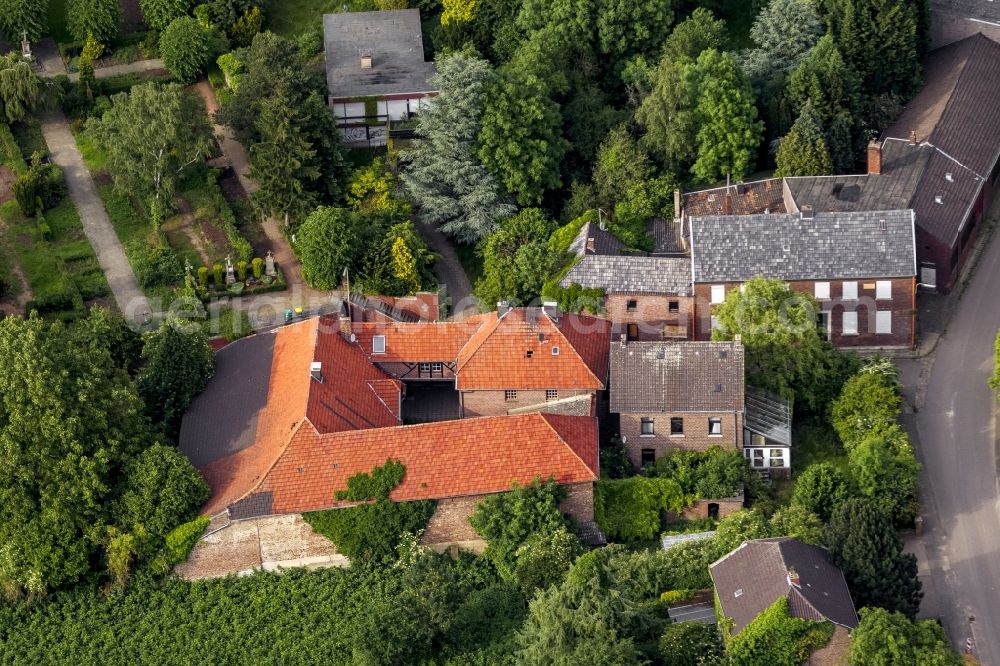 Aerial photograph Erkelenz OT Borschmich - View of Parish St.Martinus in Borsch me, the discontinued district of Erkelenz on the edge of lignite mining Garzweiler I at Erkelenz in the state of North Rhine-Westphalia