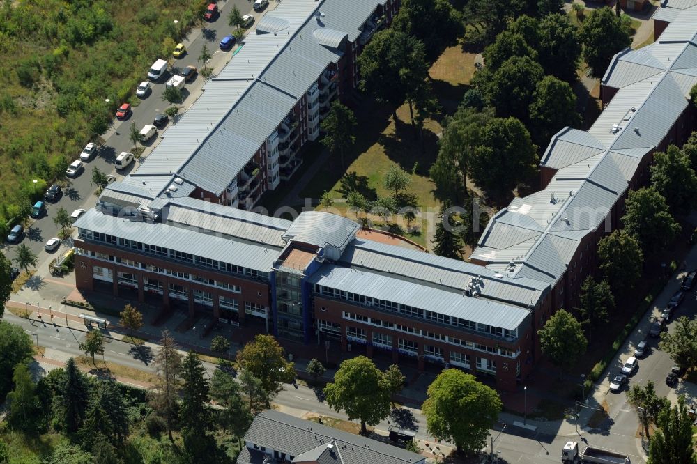 Berlin from above - Care facilities and medical centre on Weissenhoeher Strasse in the Biesdorf part of the district of Marzahn-Hellersdorf in Berlin in Germany. The building complex includes a medical centre and care home, a car rental and several offices