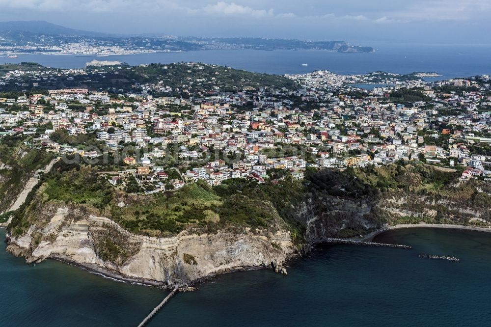 Aerial image Monte di Procida - Cliffs on the western part of the Phlegraean peninsula in the Mediterranean Sea with the city view from Monte di Procida in Italy