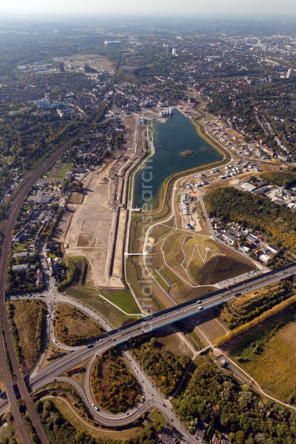 Dortmund from above - View of the Lake Phoenix in Dortmund in the state North Rhine-Westphalia. The Lake Phoenix is an artificial lake on the area of the former steelwork Phoenix-Ost. Together with the circumjacent areal a housing area and a recreational area will be created