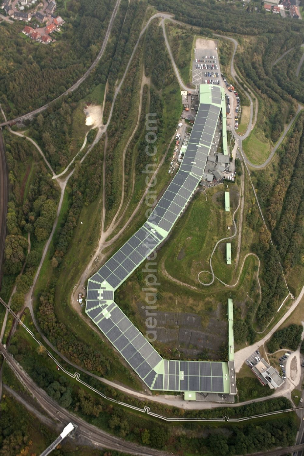 Bottrop from above - Photovoltaic system - solar power plant on the roof of the summer toboggan run on the heap in Bottrop in North Rhine-Westphalia