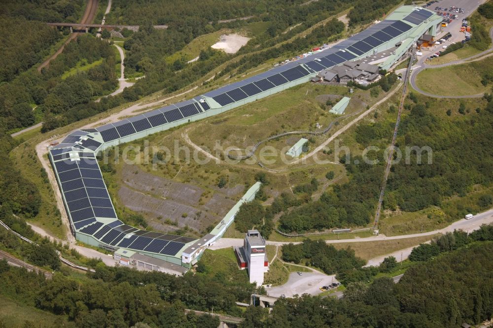 Bottrop from the bird's eye view: Photovoltaic system - solar power plant on the roof of the summer toboggan run on the heap in Bottrop in North Rhine-Westphalia