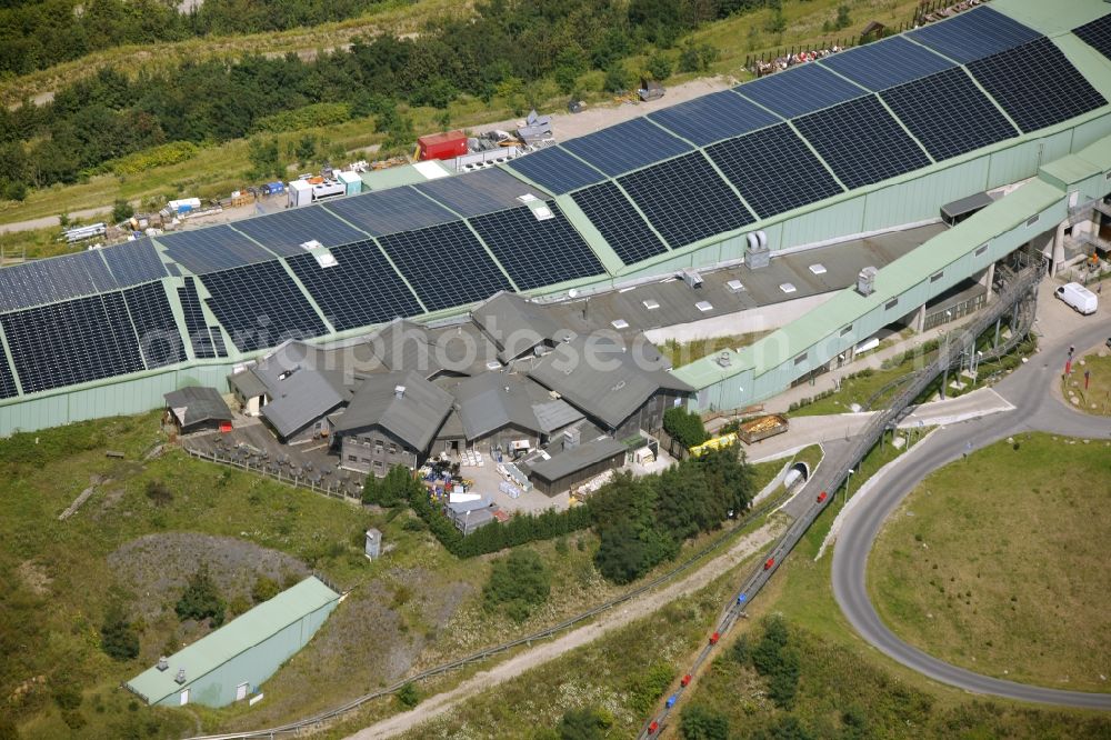 Aerial image Bottrop - Photovoltaic system - solar power plant on the roof of the summer toboggan run on the heap in Bottrop in North Rhine-Westphalia