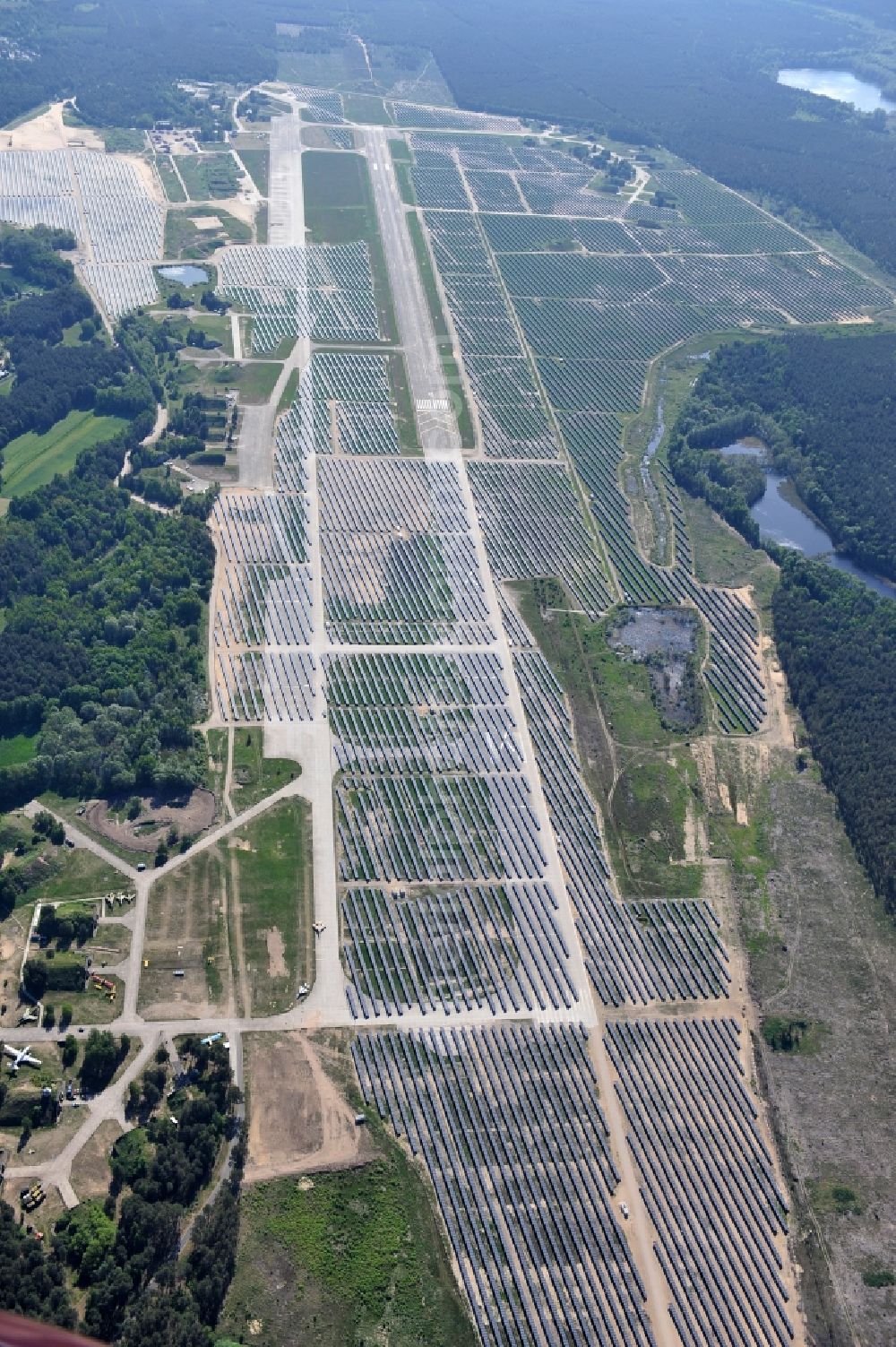 Eberswalde - Finowfurt from above - View of the almost fully assembled solar fields of the new solar power plant Finow Tower. The hybrid solar AG is currently building on the former military airport, a solar power plant