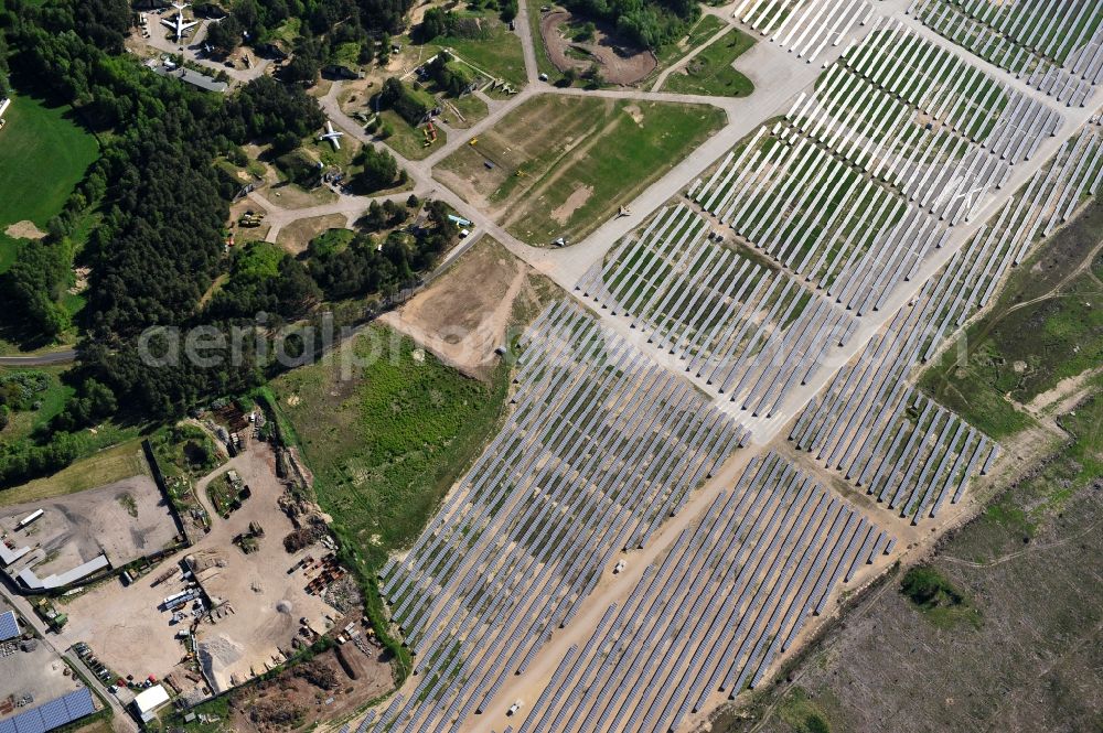 Aerial image Eberswalde - Finowfurt - View of the almost fully assembled solar fields of the new solar power plant Finow Tower. The hybrid solar AG is currently building on the former military airport, a solar power plant