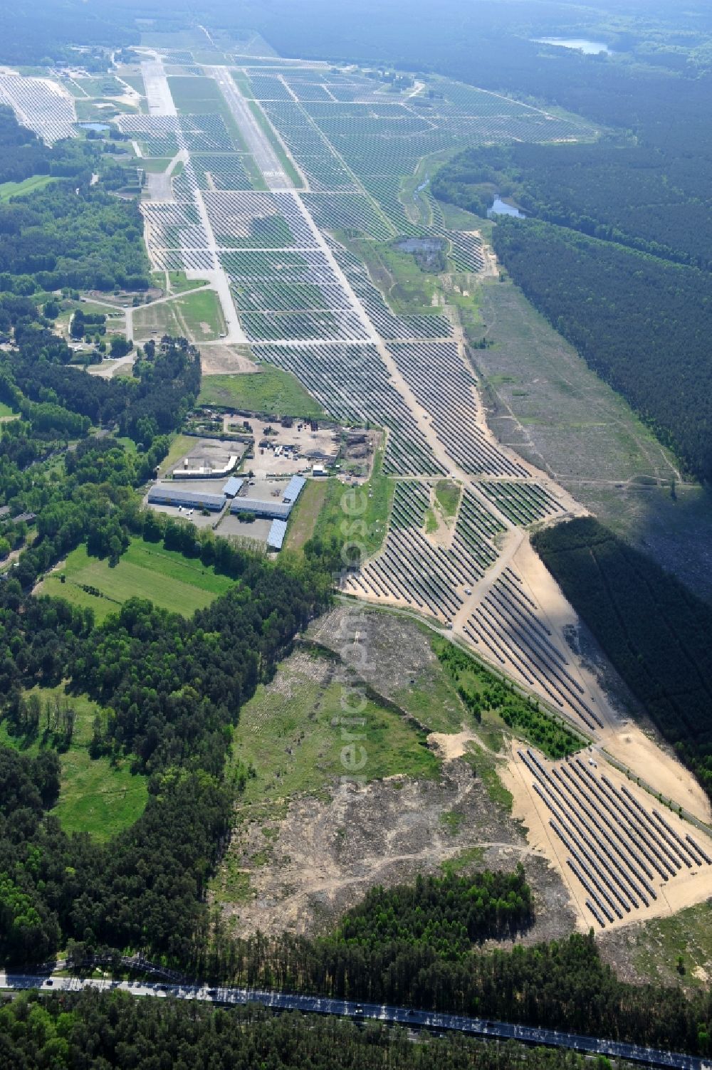 Aerial image Eberswalde - Finowfurt - View of the almost fully assembled solar fields of the new solar power plant Finow Tower. The hybrid solar AG is currently building on the former military airport, a solar power plant