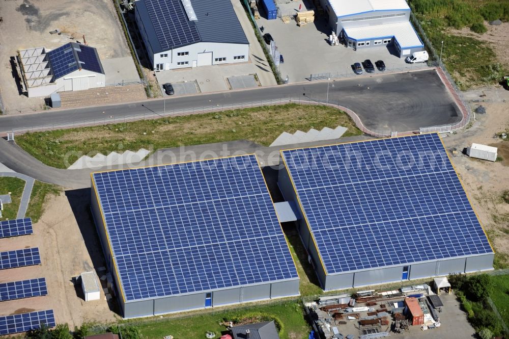 Aerial image Großostheim OT Ringheim - Großostheim 07/23/2012 view of a photovoltaic / solar power plant as a combination of open spaces and roof systems in the industrial park Großostheim in state of Bavaria. A project of Conecon GmbH