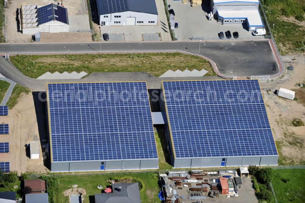 Aerial photograph Großostheim OT Ringheim - Großostheim 07/23/2012 view of a photovoltaic / solar power plant as a combination of open spaces and roof systems in the industrial park Großostheim in state of Bavaria. A project of Conecon GmbH