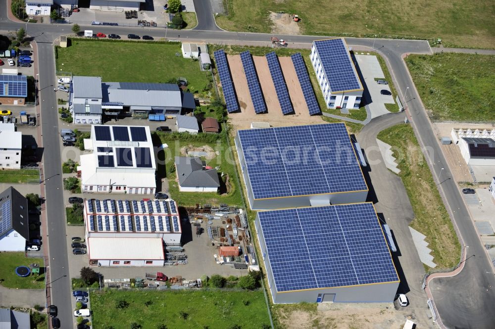 Großostheim OT Ringheim from above - Großostheim 07/23/2012 view of a photovoltaic / solar power plant as a combination of open spaces and roof systems in the industrial park Großostheim in state of Bavaria. A project of Conecon GmbH