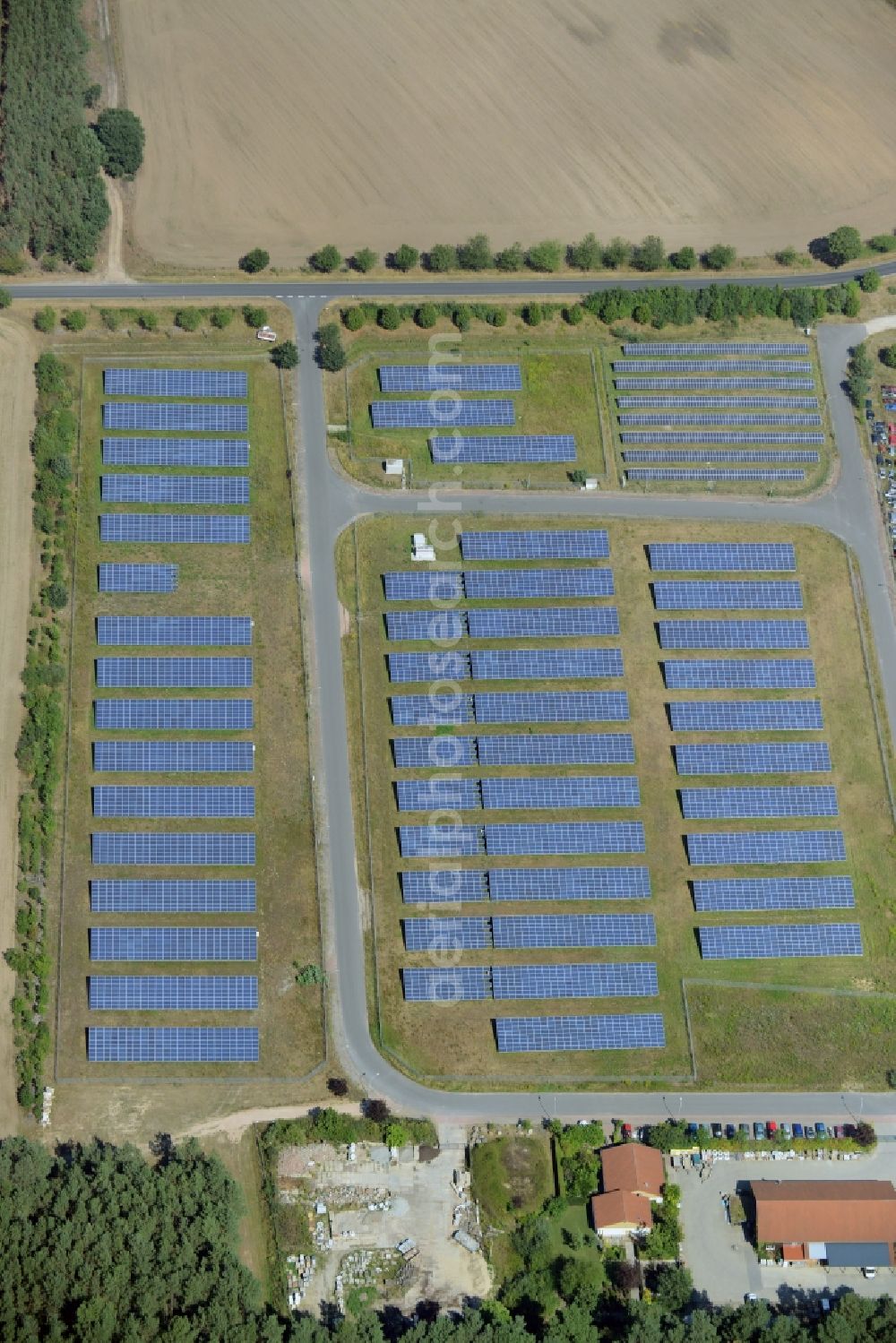 Rietz-Neuendorf from the bird's eye view: Photovoltaic and solar energy plant Solarpark Alt-Golm in Rietz-Neuendorf in the state Brandenburg. The plant with its solar cells is located in the commercial area of Alt-Golm in the North of the borough of Rietz-Neuendorf in the county district of Oder-Spree