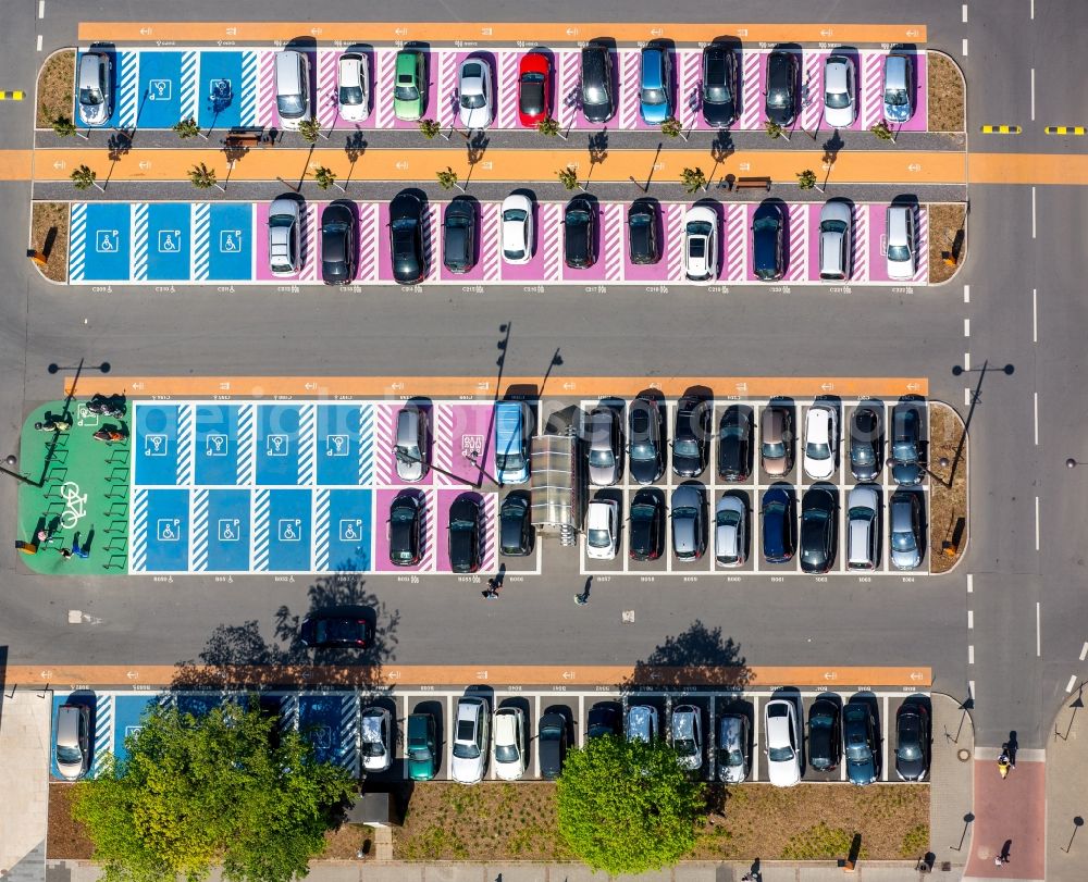 Aerial photograph Bochum - Hot pink color-coded rows of women parking and disabled parking spaces in the parking lot for automobiles at the Ruhr Park shopping center in Bochum in North Rhine-Westphalia