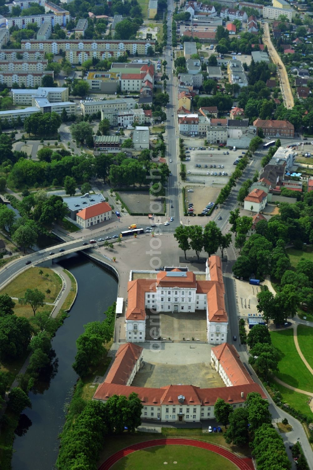 Aerial image Oranienburg - Automobile and automotive parking- area in Oranienburg in the state Brandenburg. GVG Project Development Company plans on open-space land an urban development with a local supply and service center