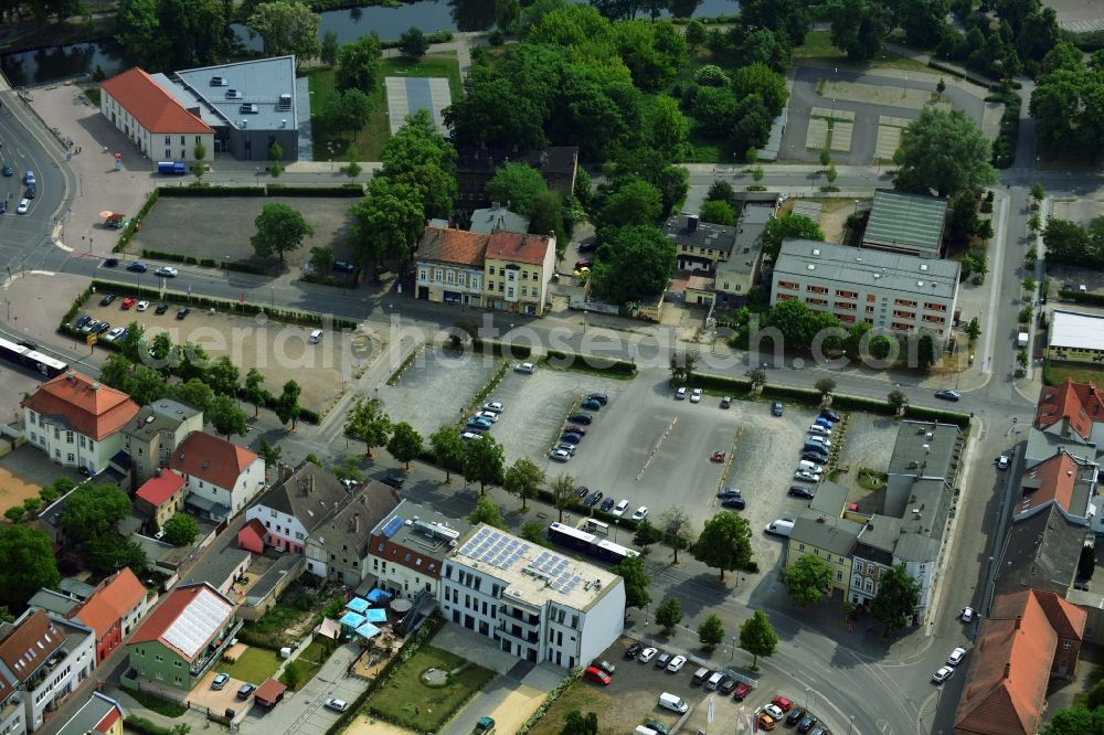 Aerial image Oranienburg - Automobile and automotive parking- area in Oranienburg in the state Brandenburg. GVG Project Development Company plans on open-space land an urban development with a local supply and service center