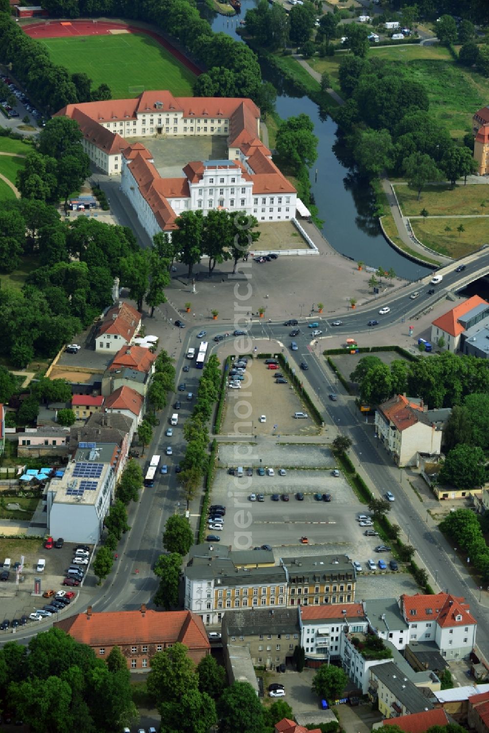 Oranienburg from above - Automobile and automotive parking- area in Oranienburg in the state Brandenburg. GVG Project Development Company plans on open-space land an urban development with a local supply and service center