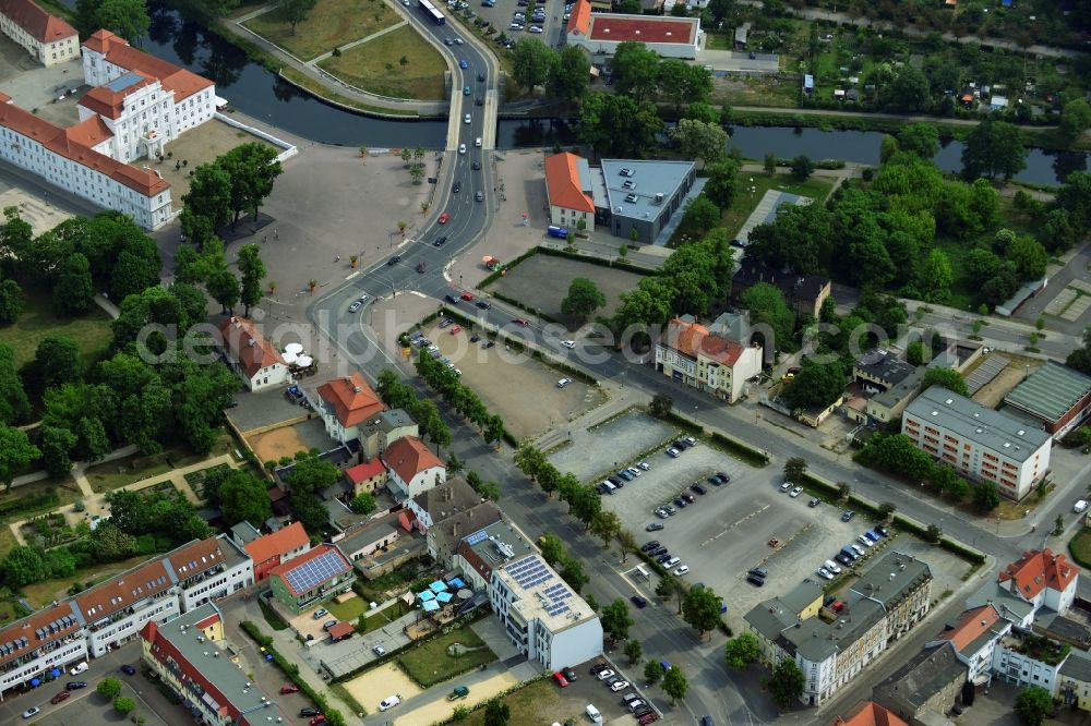 Oranienburg from above - Automobile and automotive parking- area in Oranienburg in the state Brandenburg. GVG Project Development Company plans on open-space land an urban development with a local supply and service center