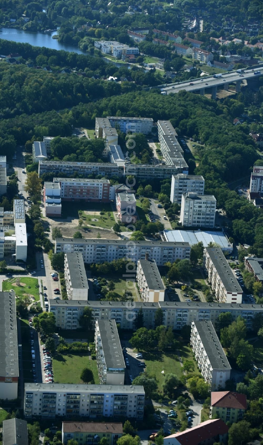 Rüdersdorf from the bird's eye view: Skyscrapers in the residential area of industrially manufactured settlement along the street Friedrich-Engels-Ring in Ruedersdorf in the state Brandenburg